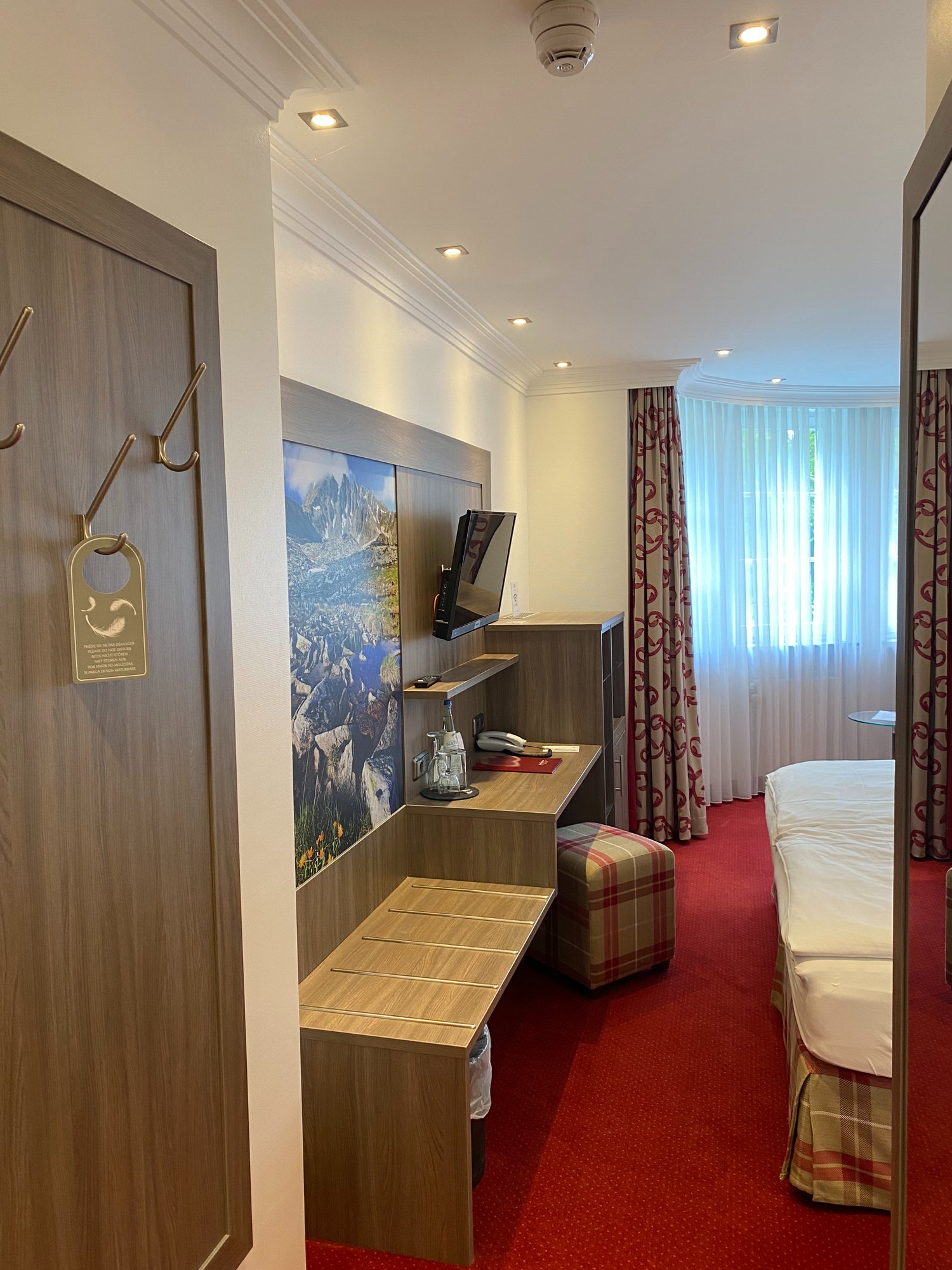 Einzelzimmer Comfort im Hotel Landhaus Alpinia mit Einzelbett und gemütlicher Sitzecke